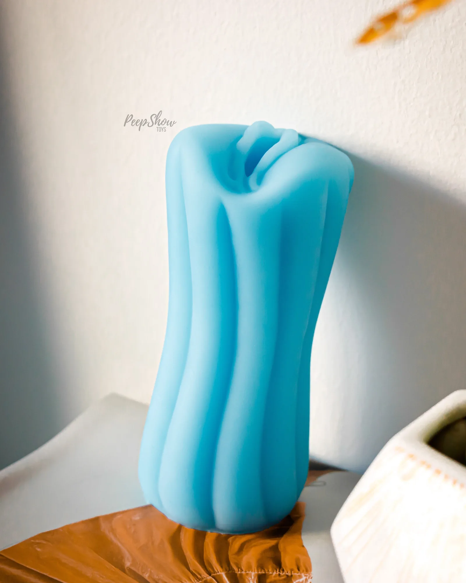 NS Novelties Firefly Yoni glow-in-the-dark silicone stroker in blue, seller photo